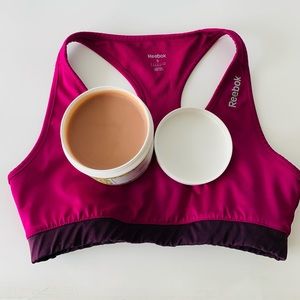 Lightly used Reebok sports bra with Cocoa butter